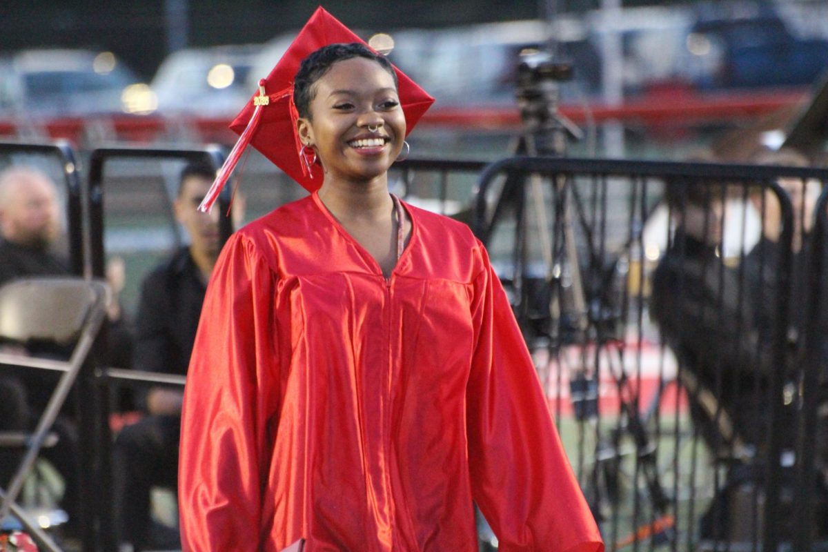 Senior Layla Holmes is all smiles after receiving her diploma. Photograph by Tim Hare