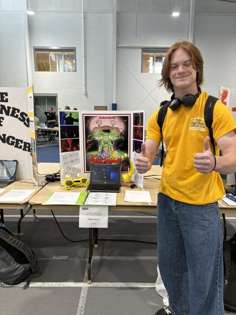 Gabriel Wede at the Pennsylvania Media and Design Competition showing off his movie and trifold