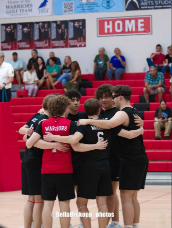 The Warrior boys volleyball team and captain Noah Hernandez huddle together prior to the start of play. “This picture shows our strong team chemistry,” Hernandez said. “Even with a lot of new players, we truly bonded well and became a very different team from the previous years. In the picture, we are bringing it at the start of a new set, talking about plans and hyping each other up to win a set.“
Photograph Courtesy of Bella Brokopp
