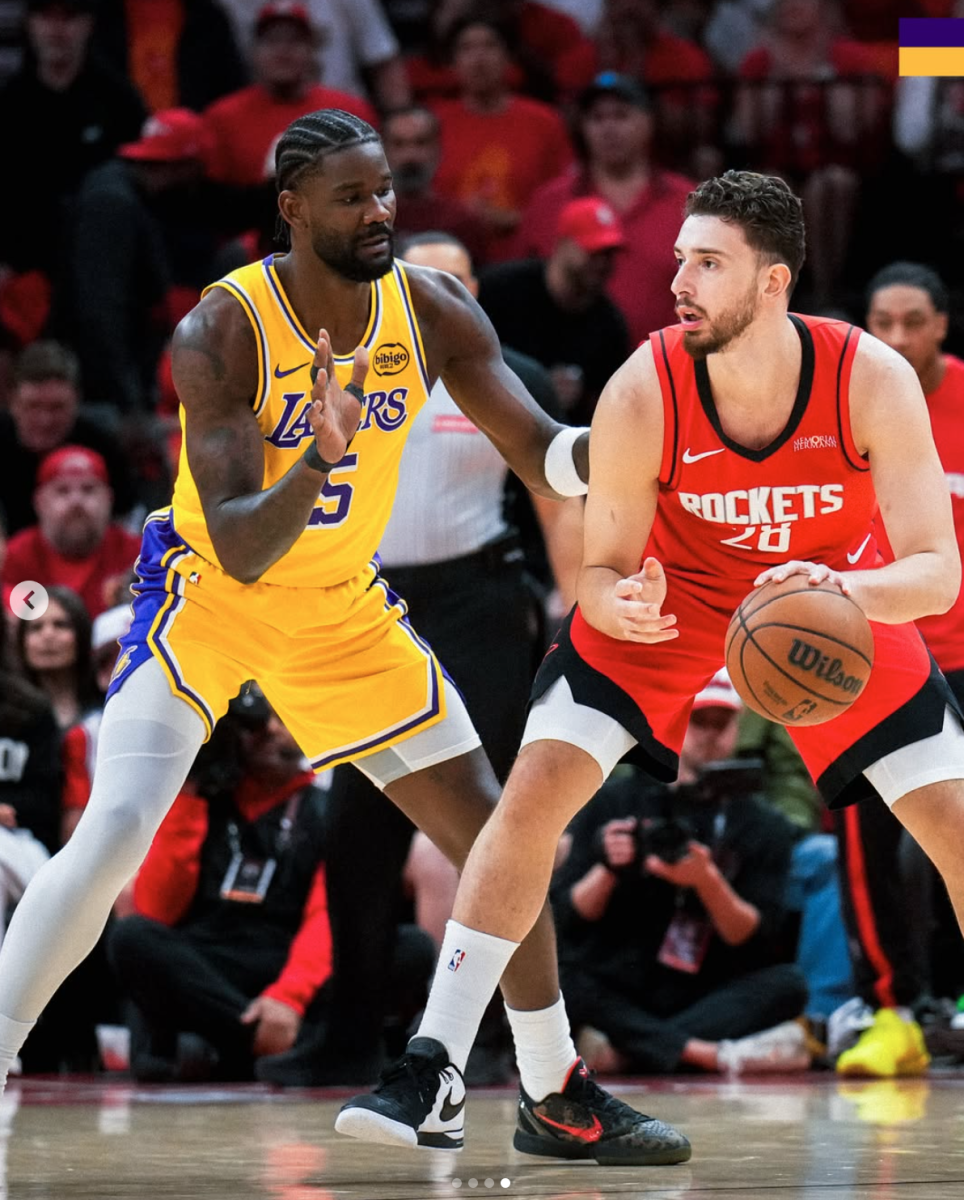 Rockets player Alperen Sengun dribbles past Lakers number 5 Deandre Ayton Photograph Courtesy of @NBA via Instagram